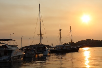 During the day, brown and white ship sailing on the water
